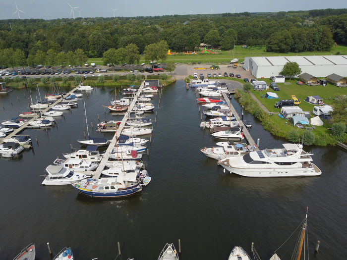 High angle view of sailboats moored in lake