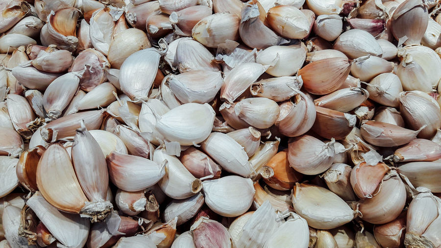 Full frame shot of garlic cloves at market stall