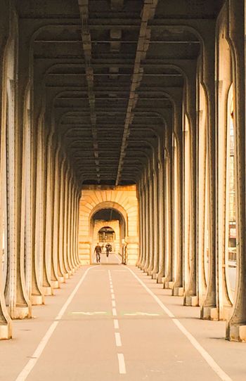 Long walkway below bridge