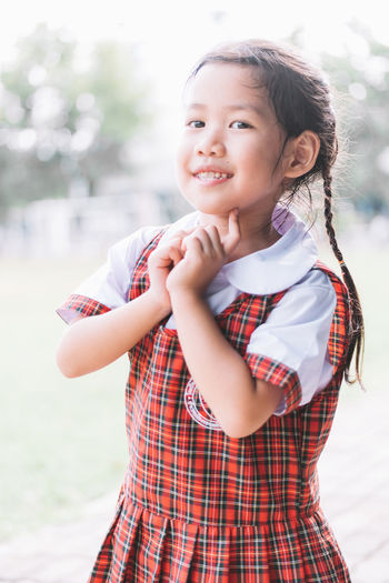 Close-up portrait of smiling schoolgirl