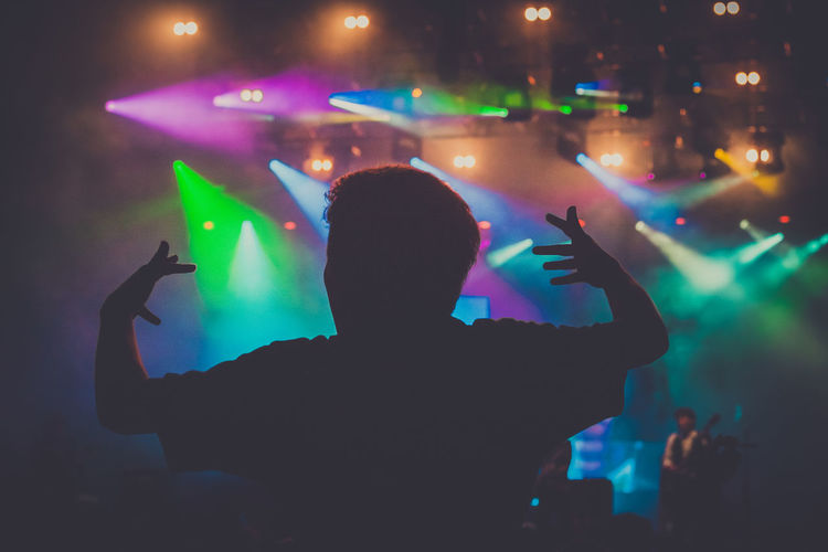 Silhouette people enjoying at nightclub