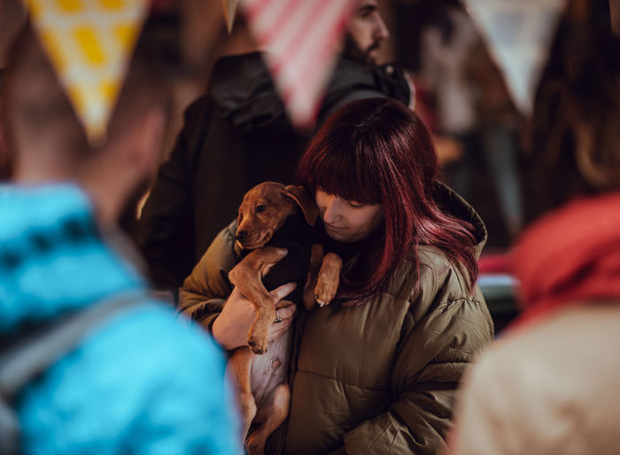 Woman holding dog 