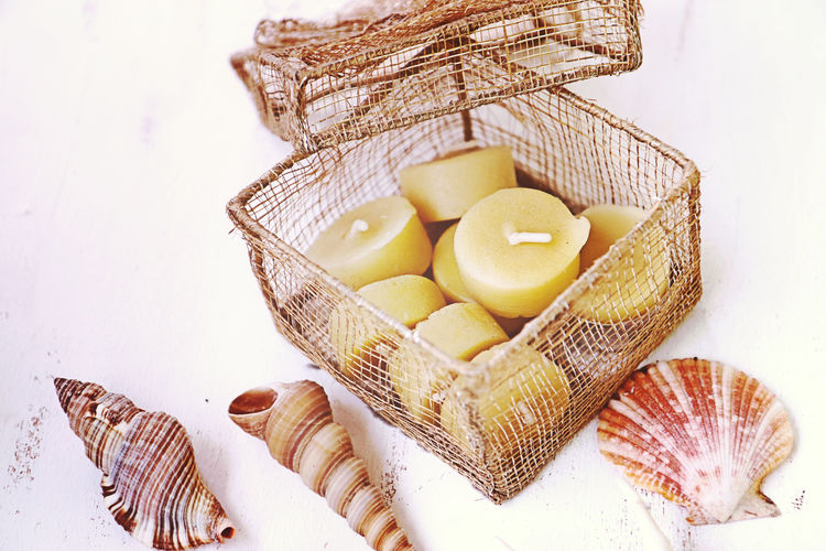 High angle view of shells in basket on table