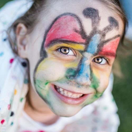 Portrait of smiling girl with painted face
