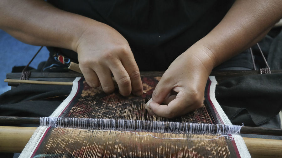 Cropped hand of person working