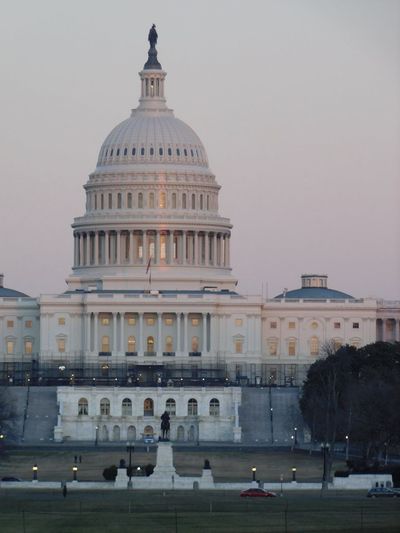 Portrait capture of the us capitol building during a winter sunset