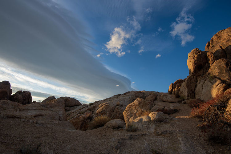 Alabama hills desert rock formations with lenticular cloud