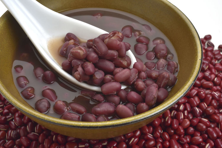 High angle view of kidney beans against white background