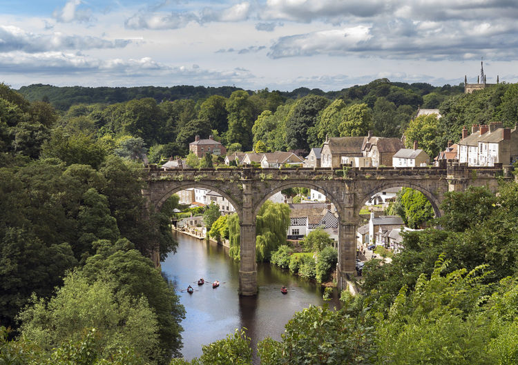 Scenic view of bridge against cloudy sky