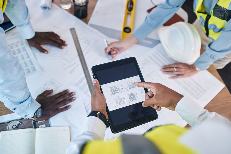 Midsection of man working on table
