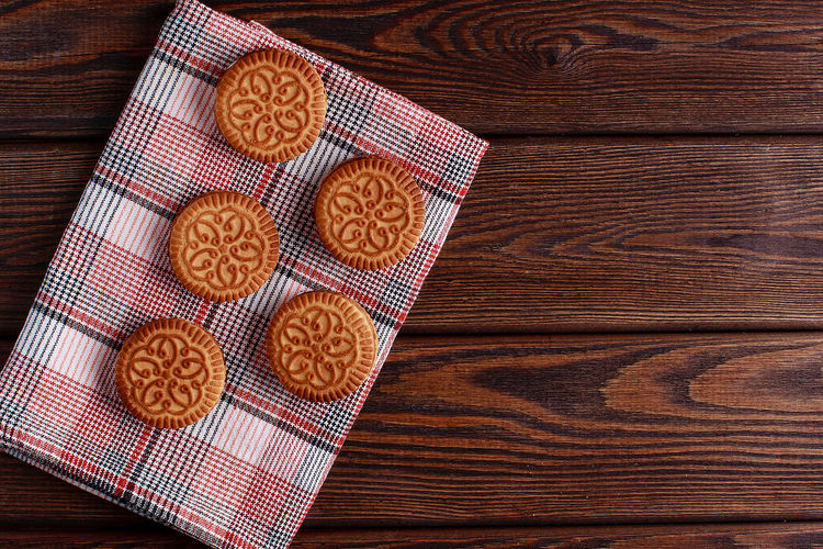 Sandwich biscuits, cream biscuits, cookies with cream filling on wooden table