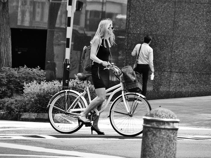 Bicycle leaning on bicycle