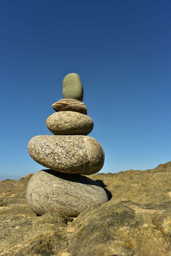Balanced art form zen rock stack found on beach in baja, mexico