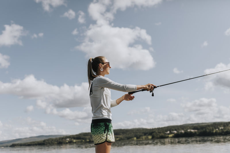 View of woman fishing at lake