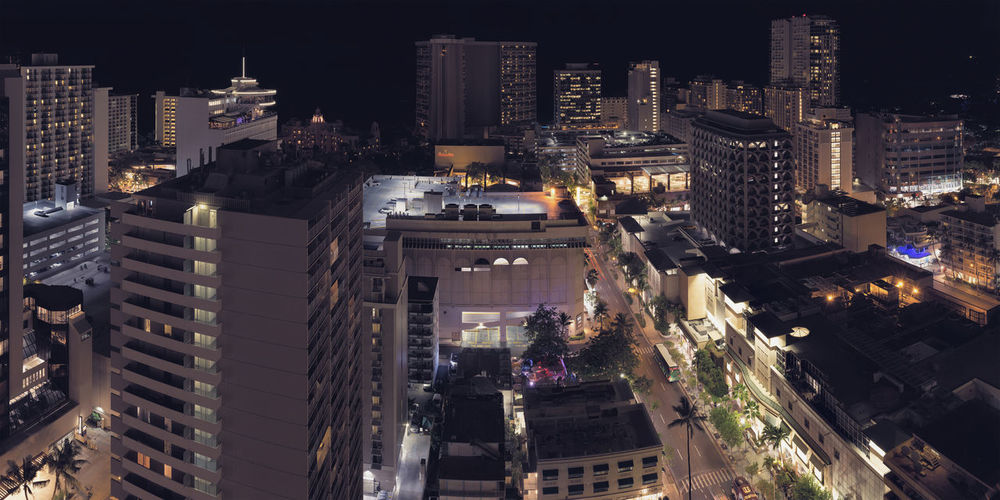 High angle view of illuminated city buildings at night