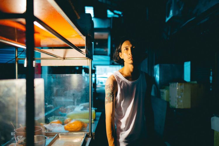 Taiwan's boy Night One Person Young Adult Casual Clothing Window Women Indoors Business Finance And Industry Real People Adult Retail Lifestyles One Woman Only Standing Food Young Women Only Women Illuminated Taiwan EyeEm People EyeEmNewHere HUAWEI Photo Award: After Dark