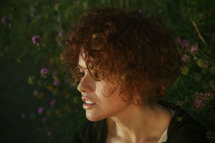 Close-up of woman with curly hair