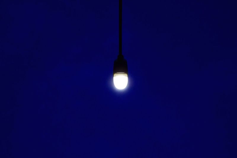 Low angle view of lit lamp