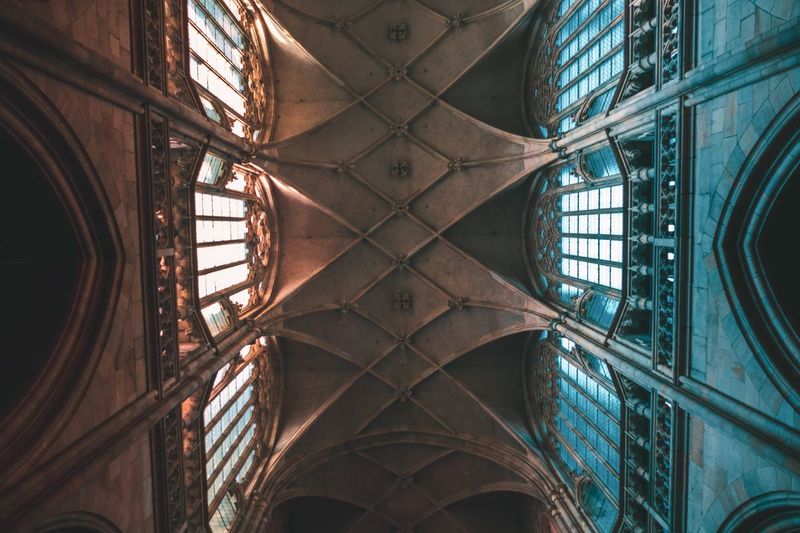 Directly below shot of ornate ceiling in building