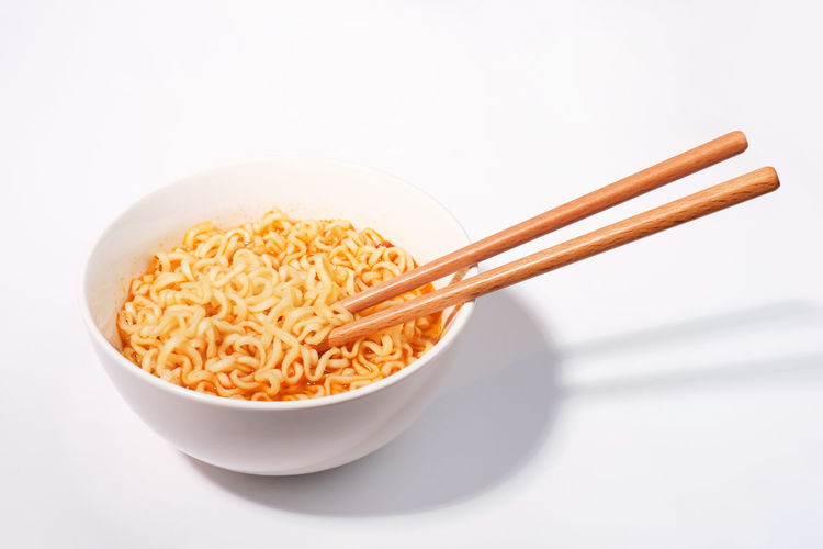 Close-up of food in bowl on white background