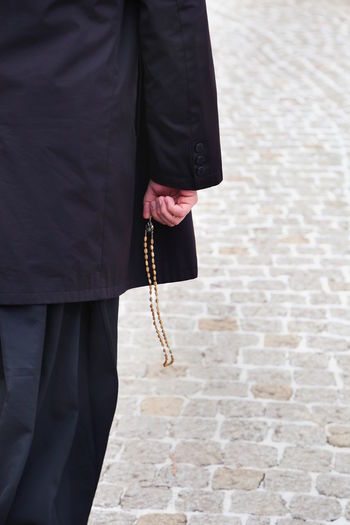 A priest holding a rosary