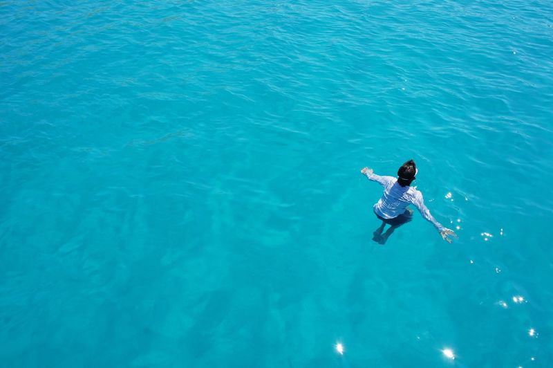 High angle view of person swimming in sea