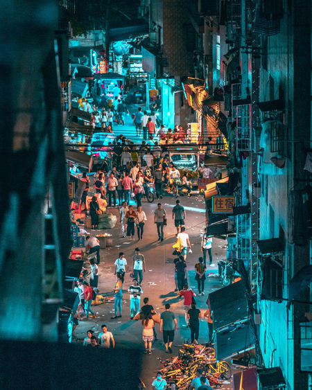 High angle view of people on street at night