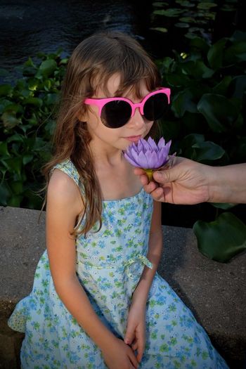 Girl wearing sunglasses and plants