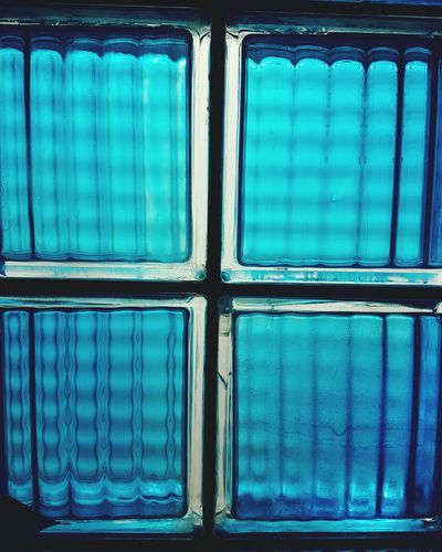 Full frame shot of blue stained glass window