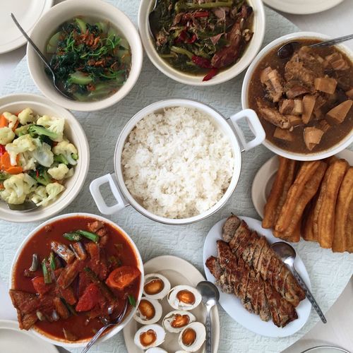 High angle view of peranakan food served on table