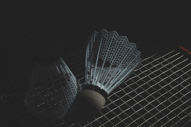 Close-up of shuttlecock on racket