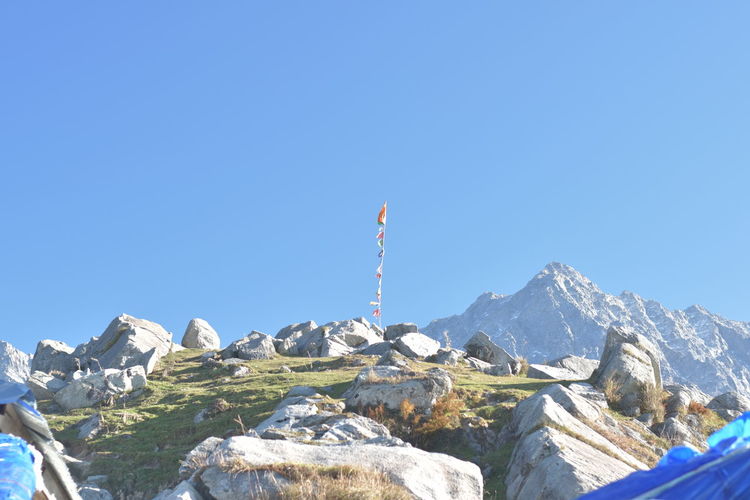 Low angle view of townscape against clear blue sky 
