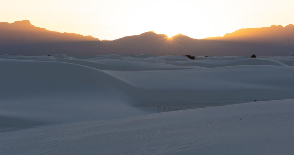 Sunstar over the mountains at white sands national park