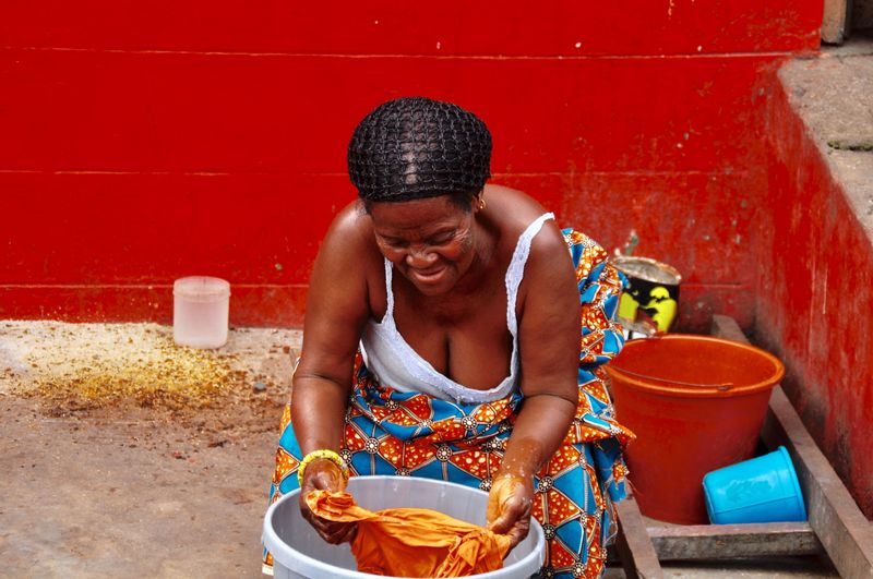 Senior woman washing clothes 