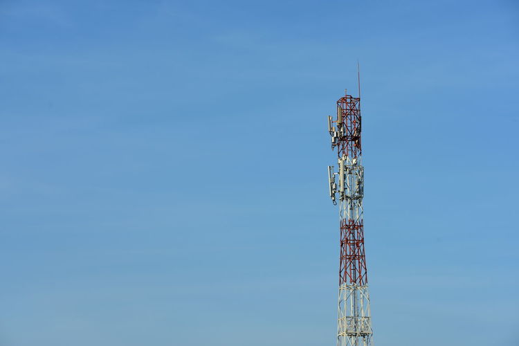 Communications tower against blue sky