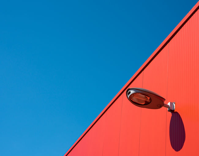 Low angle view of building against clear blue sky