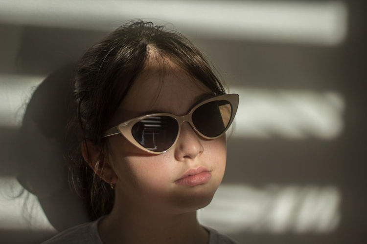 Portrait of young woman wearing sunglasses