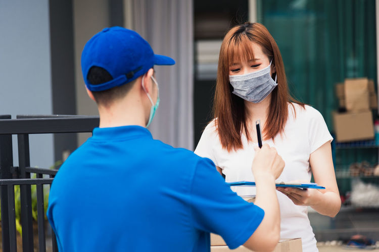 Man delivering package to woman