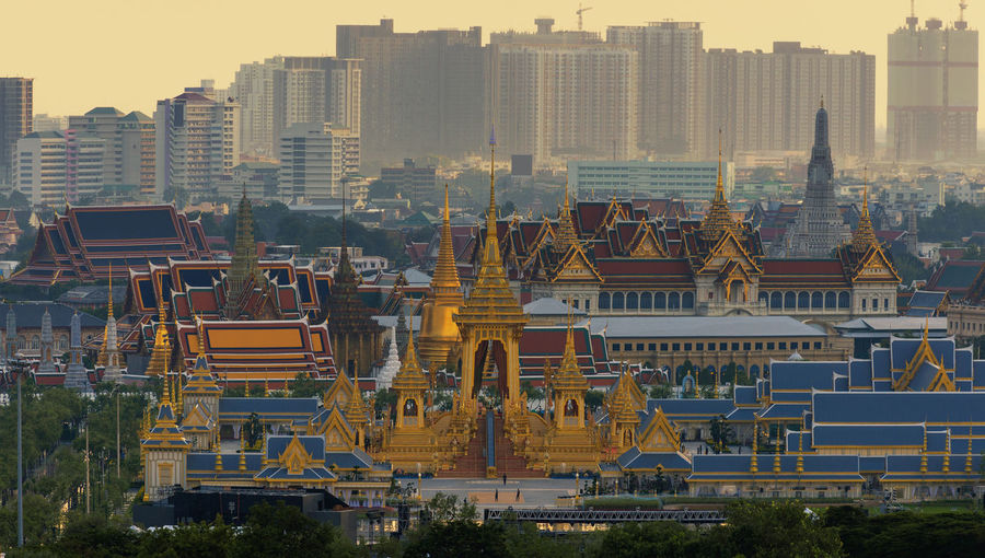 High angle view of temples in city during sunset