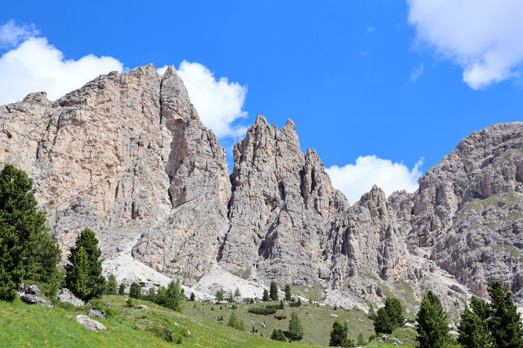 Low angle view,  against sky, of the cir mountain group standing over gardena pass in the dolomites.