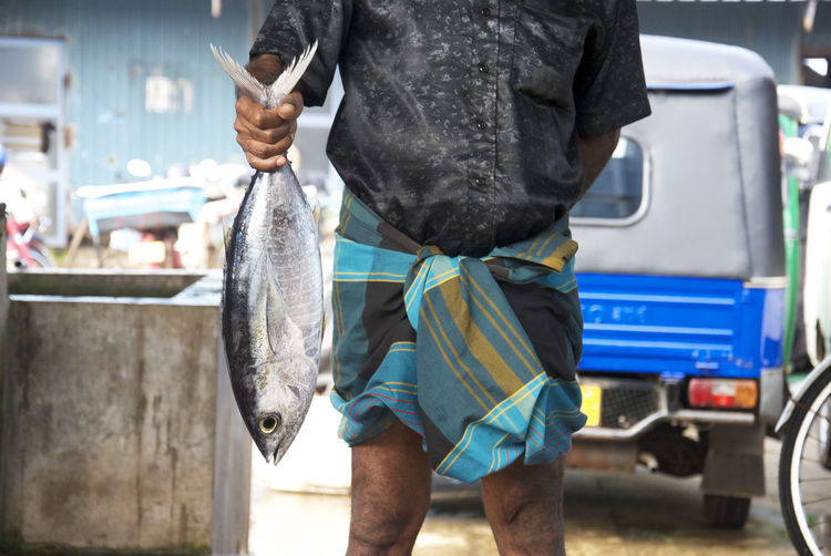 Full length of man holding fish