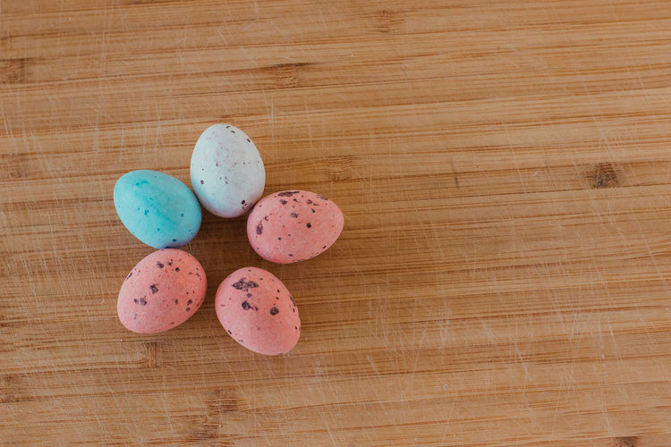 Close-up of multi colored eggs on table