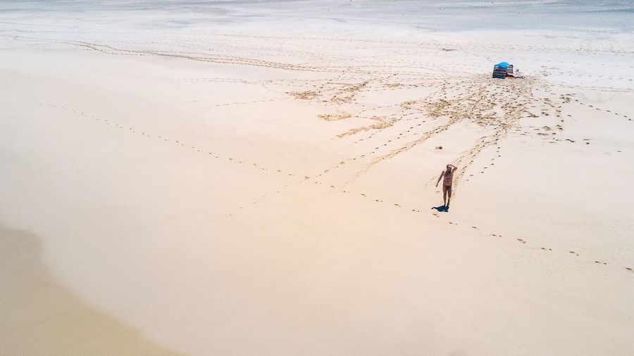 Full length of man on sand at beach
