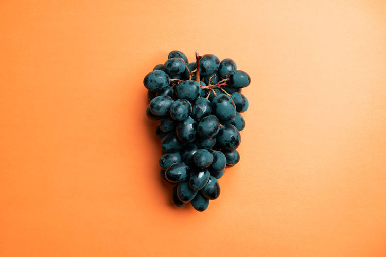 Close-up of grapes against black background
