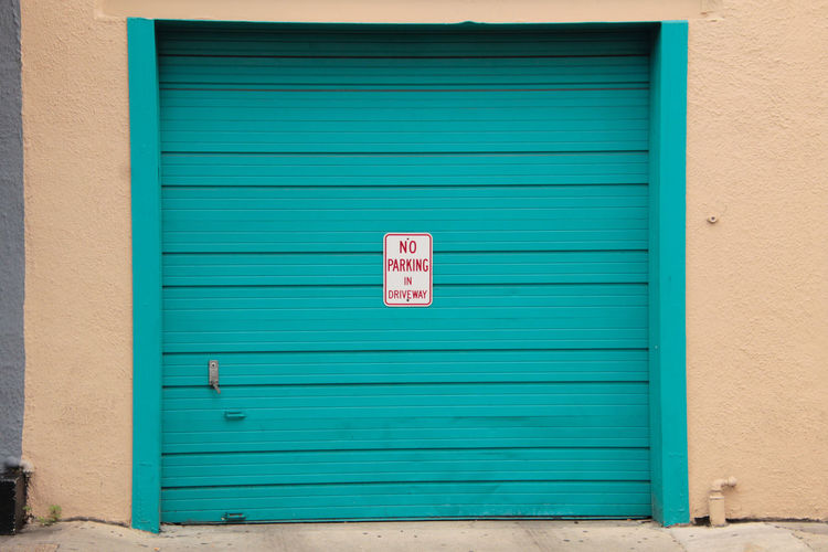 No parking sign on closed shutter