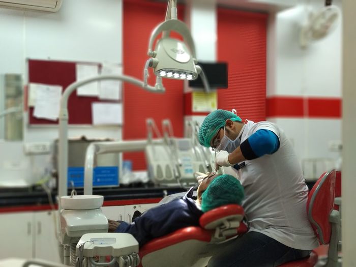 Dentist checking patient