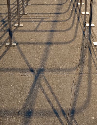 High angle view of shadow on footpath