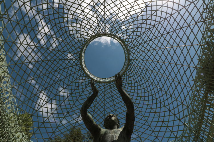 Low angle view of a sculpture against sky