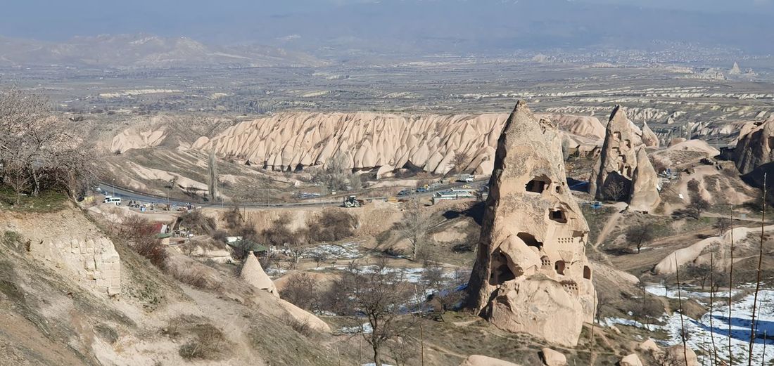 Goreme valley with ancient chapels carved into hillside, cappadocia, turkey