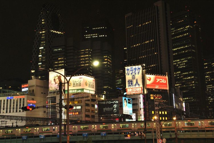 Illuminated modern buildings in city at night